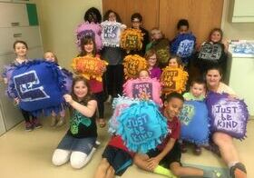 kids holding pillows they made